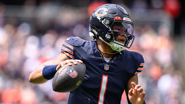 Chicago Bears quarterback Justin Fields (1) scrambles against the Buffalo Bills during the first quarter at Soldier Field.